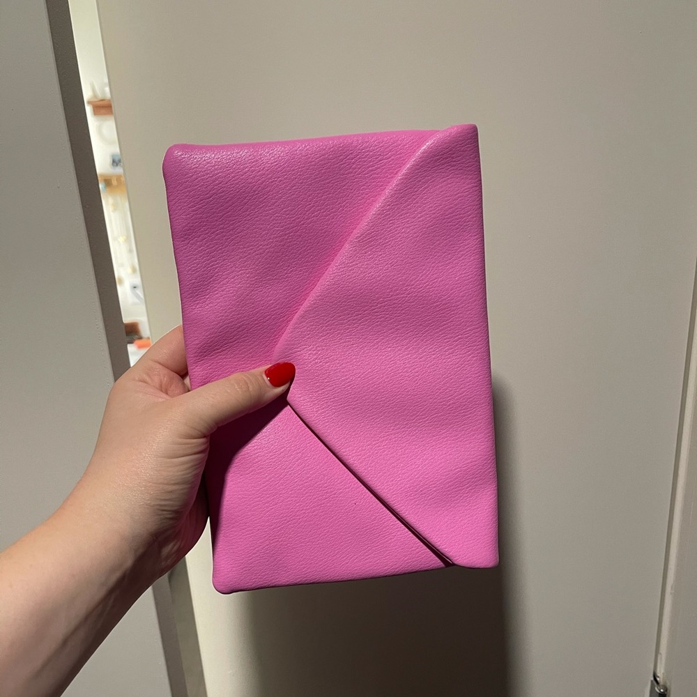 Pink faux leather clutch with optional chain